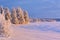 Frozen Ã„ijÃ¤jÃ¤rvi lake in Finnish Lapland in winter at sunset