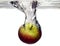 Fruit apple is dropped into water