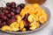 Fruit apricots, nectarines, cherries on a large plate