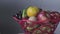 Fruit basket rotating on table. background