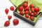 Fruit bowl strawberry background, red natural berry on table