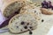 Fruit bread with aronia sliced on a wooden plate with dried aron