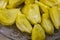 The Fruit Bulbs or Pods or edible pulps of jackfruit is placed in a plate. The scientific name of jackfruit is Artocarpus
