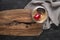 Fruit cake on tumbled stone floor and wooden presentation