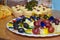 Fruit canape with colored plastic heart skewers on cocktail or a buffet table