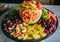 Fruit carving for wedding reception. Watermelon, peaches, grapes and pineapples are on the plate. Dessert for guests