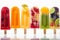 Fruit colorful assorted fruit popsicles ice lollies isolated on a white background