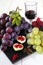 Fruit composition: grapes, figs and glass of red wine