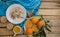 Fruit, corn flakes, milk and orange juice on the wooden table