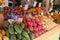 Fruit counter with mango, longan, dragon, mangosteen, lemons, tangerines in Thailand. Trade. Asia. Green diet