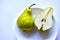 Fruit of a cut green pear on a white plate