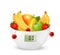 Fruit with in a digital weight scale. Diet concept.