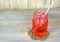 Fruit drink in mason jar on rope coaster