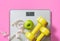 Fruit, dumbbell and scale, fat burn and weight loss