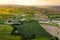 Fruit field and vineyards on sunset, drone view