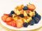 Fruit fresh breakfast with blueberries, waffle and milk