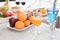 Fruit and fruit juice on marble counter in kitchen room. Apple and orange juice and vegetable on table. Food and drinks concept.