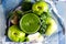 Fruit green smoothie in a transparent bowl apples and greens healthy food top view