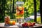 fruit-infused vodka in glass dispenser with picnic setting