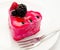 Fruit jelly cake and fork on the plate isolated on a white