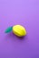 Fruit made of paper. Purple background. Tropics. Flat lay