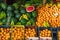 Fruit market. on display summer organic fresh fruit counter watermelons oranges bananas pineapples colorful