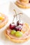 Fruit mini tarts with cherry