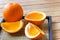 Fruit Oranges full and slice on plates and on wood table with lighting and shadow