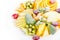 Fruit plate, . apple, mandarin, kiwi, grapes, mint, pear, apple, pineapple. Fruits salad in plate close-up