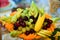 Fruit plate with fresh grapes, cherries, orange, banana and Apple
