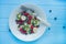 Fruit plate. Kiwi, banana, blueberry and raspberry fruit salad. Wood background