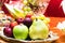 Fruit plate with pear, apple, strawberry and grape.