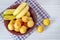 Fruit plate on the white background. Peaches and bananas on a plate