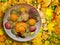 Fruit platter with spiced fruits on autumn leaves