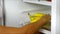 Fruit refrigerator - female hand open fridge and take banana fruit