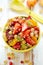 Fruit salad with the addition of quinoa, honey, lemon juice and fresh mint