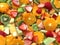 Fruit salad background with citrus and melons