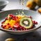 fruit salad with exotic fruits in a porcelain bowl