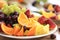 Fruit salad with orange, pineapple, pear and grape. Vegan. Weight loss. Covid-19