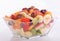 Fruit salad in rich colors in a glass bowl