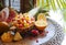 Fruit salad served in half pineapple on a wooden table. Natural eating concept, Diet healthy food, nutrition. pineapple, mango,