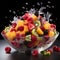 Fruit salad in a transparent plate on a black background with splashes of water