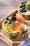 Fruit salad with yogurt in carved melon cantaloupe bowl