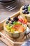 Fruit salad with yogurt in carved melon cantaloupe bowl