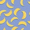 Fruit seamless pattern, bananas with shadow on bright blue background. Summer vibrant design. Exotic tropical fruit