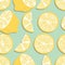 Fruit seamless pattern, lemon slices and halves on mint green background. Summer vibrant design. Exotic tropical fruit