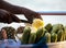 Fruit seller in India. Ripe pineapples, cucumbers, salt spices. Traditional delicacy in india goa state