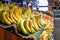 Fruit shop greengrocer display shelf with exotic fruits and bananas