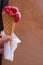 Fruit sorbet in waffle cone in hand. Close-up