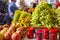 Fruit stall. Peaches, green and black grapes on the market. Sale of seasonal fruits